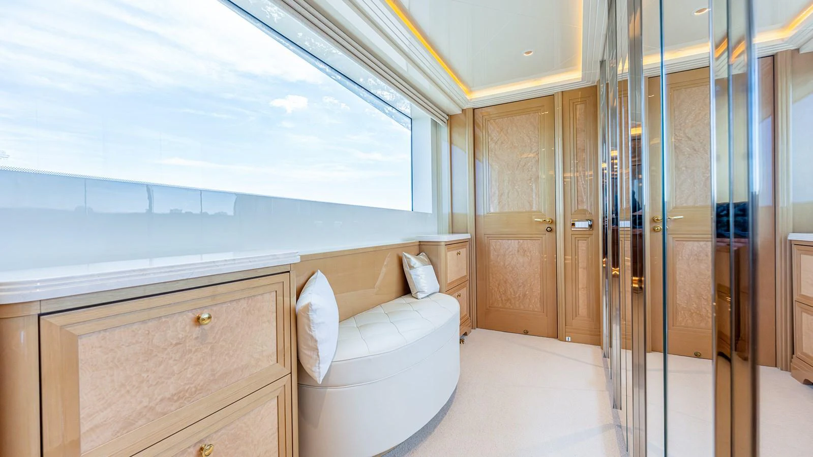 A luxurious interior space with elegant wood finishes and ample natural light. aboard BETTY JANE Yacht for Sale