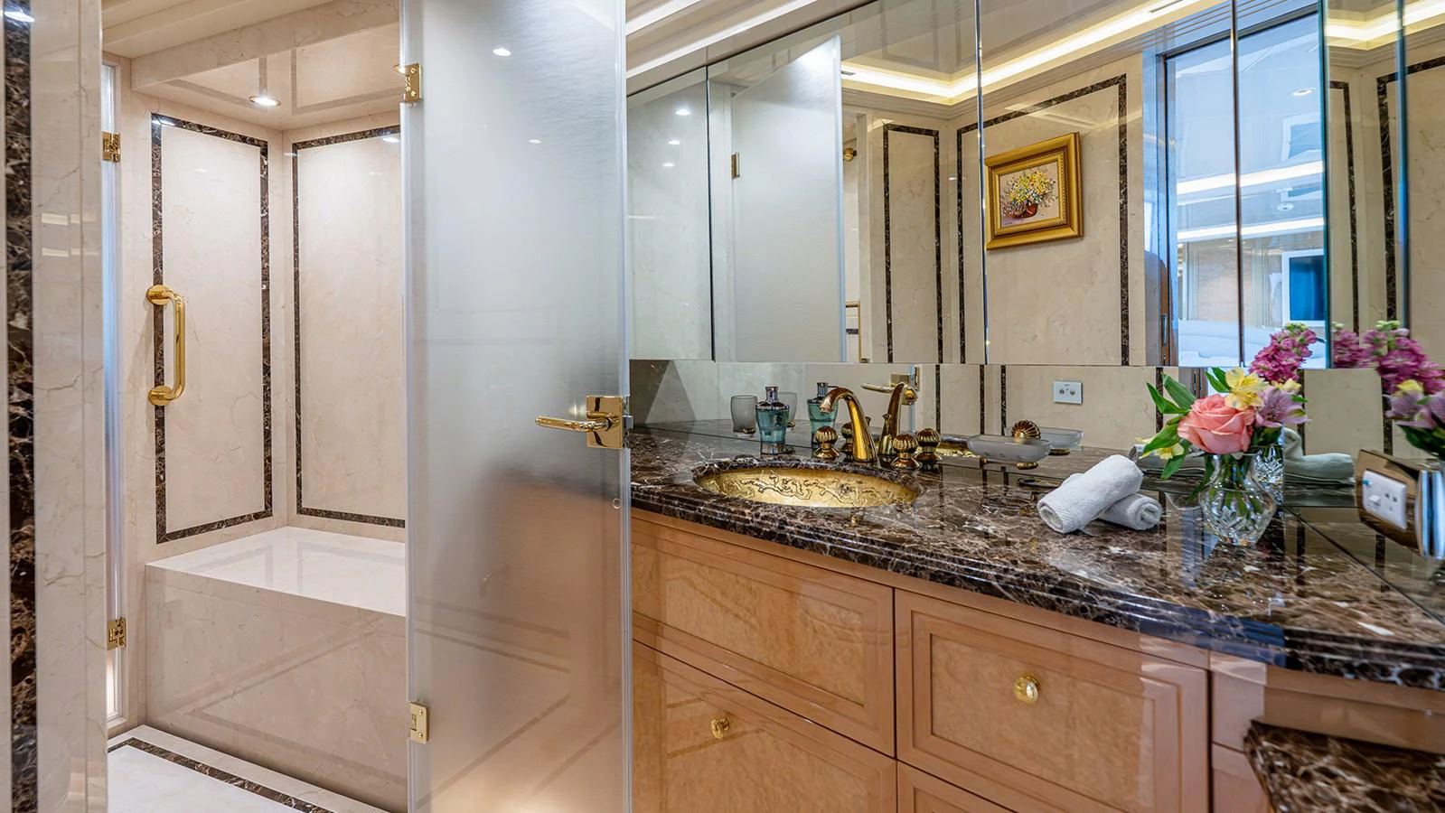 The luxurious bathroom features elegant marble countertops and a spacious shower area. aboard BETTY JANE Yacht for Sale