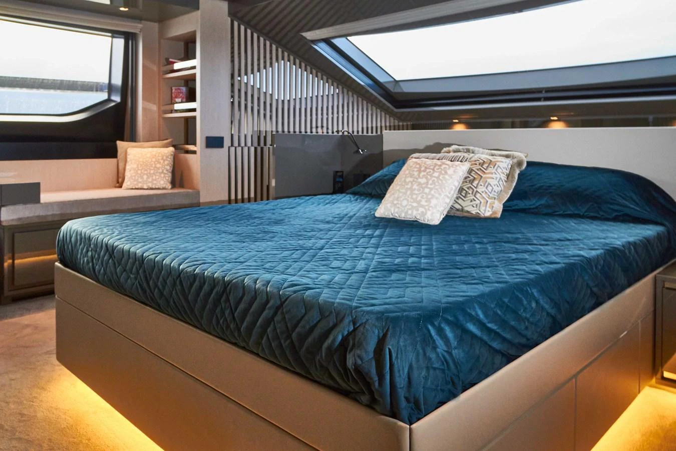 The stateroom features a luxurious bed with elegant bedding and modern decor. aboard KAPUSHA Yacht for Sale