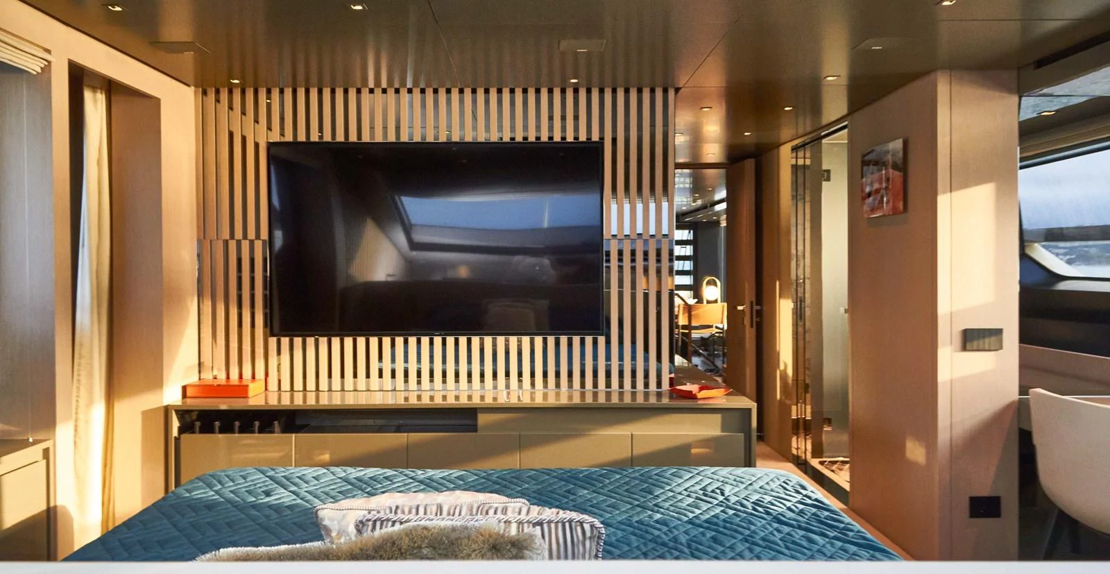 The master stateroom features a large flat-screen TV and modern decor with ample natural light. aboard KAPUSHA Yacht for Sale