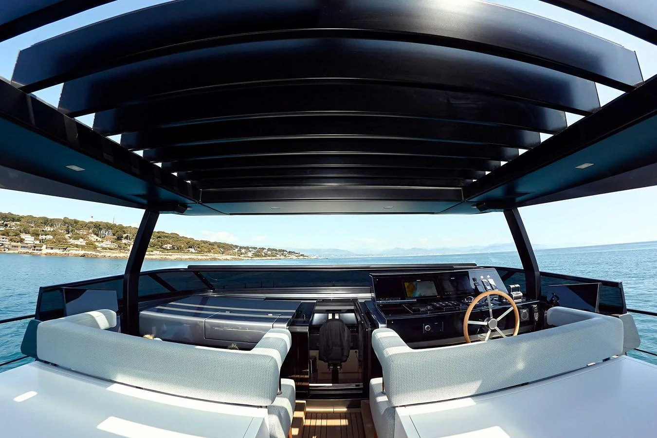 The helm station offers a sleek and modern design with expansive views of the surrounding waters. aboard KAPUSHA Yacht for Sale