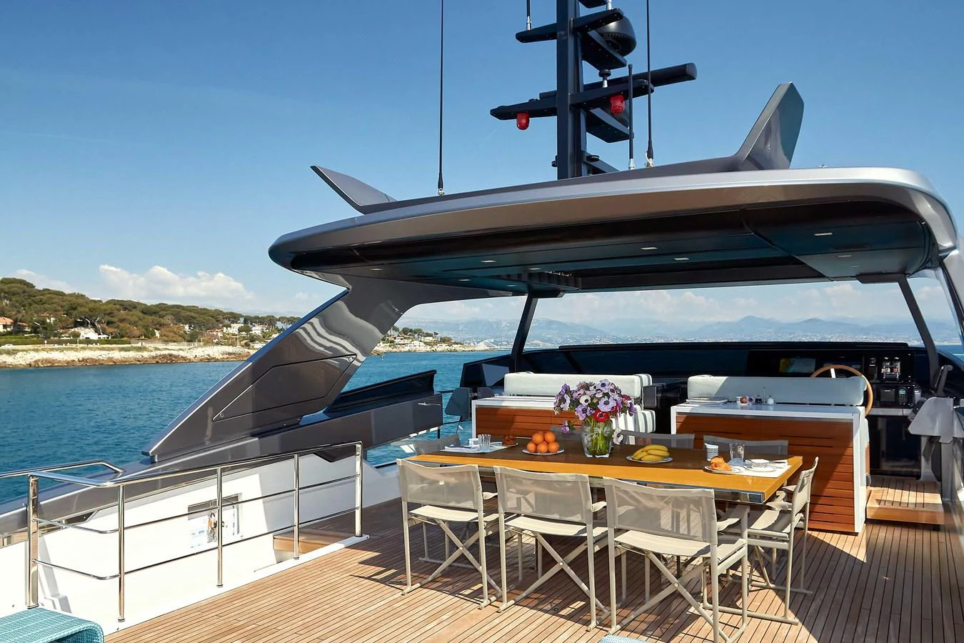 The aft deck offers a luxurious dining area with stunning views of the surrounding waters. aboard KAPUSHA Yacht for Sale