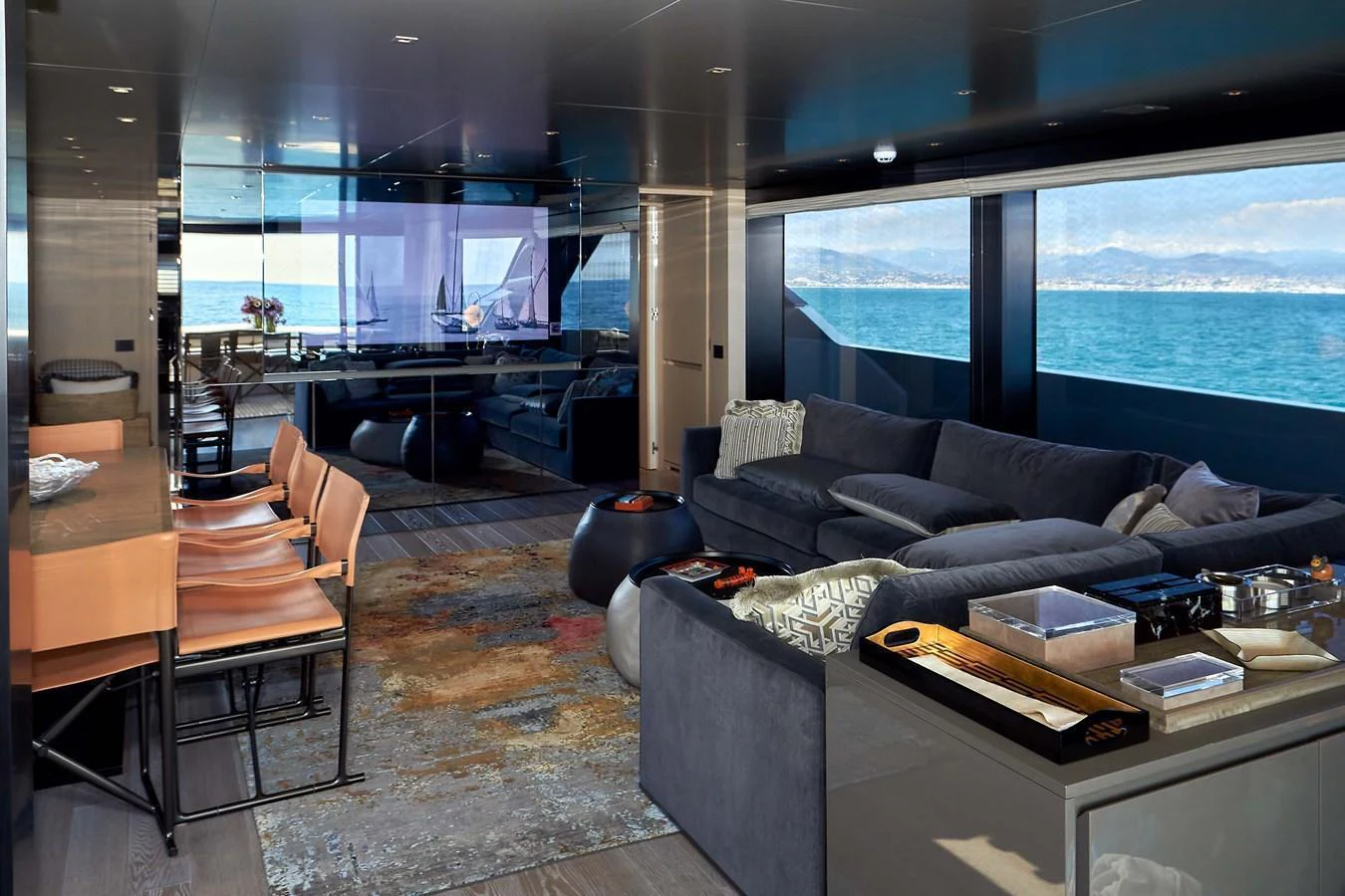 The yacht's salon offers a luxurious and comfortable space with panoramic views of the sea. aboard KAPUSHA Yacht for Sale