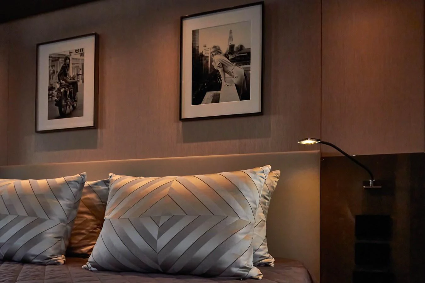 A cozy stateroom featuring elegant decor and framed artwork. aboard KAPUSHA Yacht for Sale