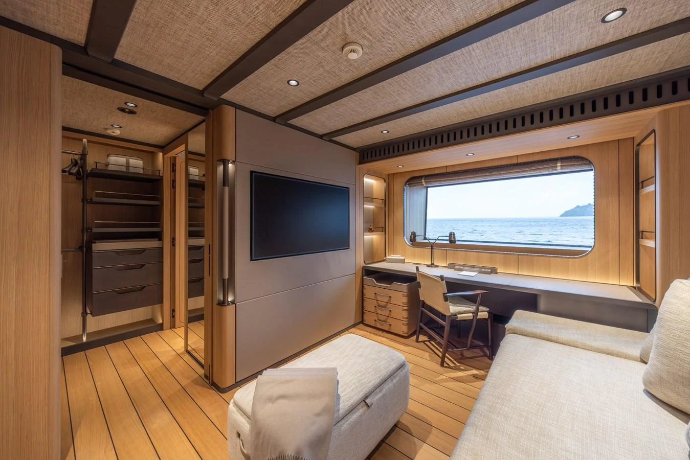 The stateroom features a spacious and elegant design with a large window offering a stunning sea view. aboard AKULA Yacht for Sale