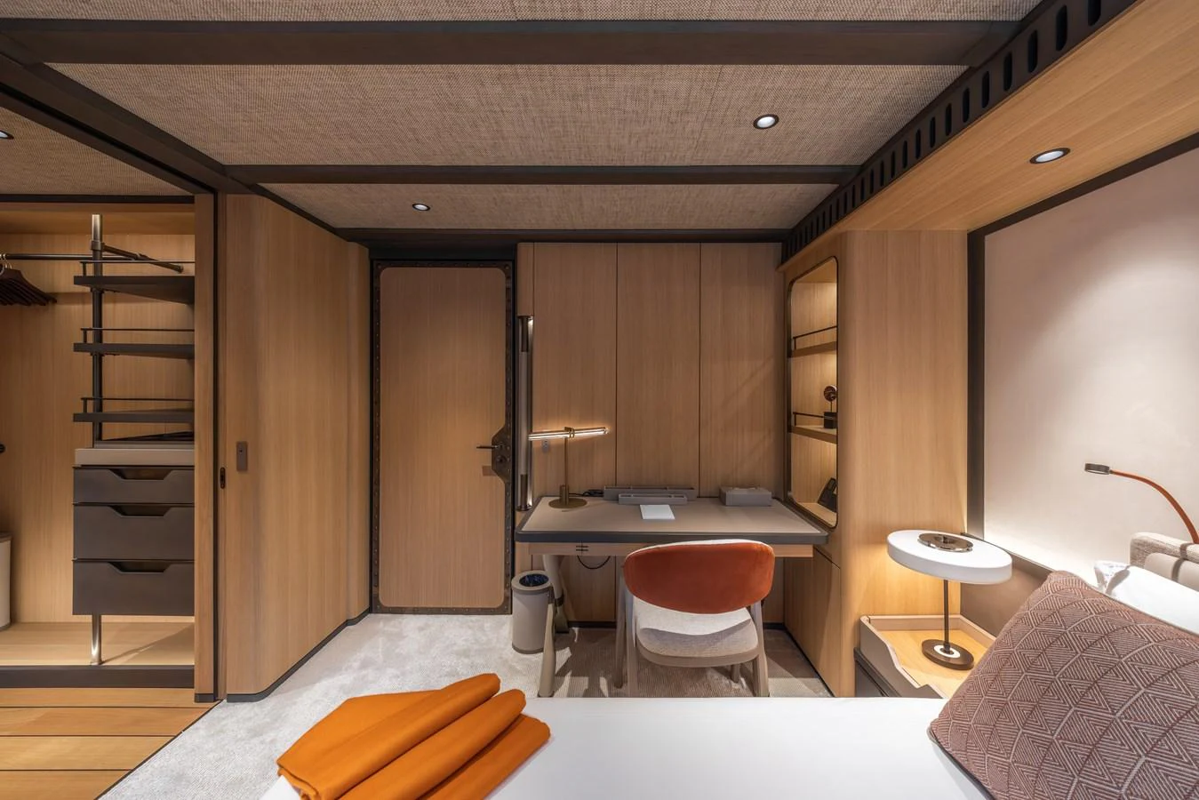A luxurious stateroom featuring a modern desk, ample storage, and elegant decor. aboard AKULA Yacht for Sale