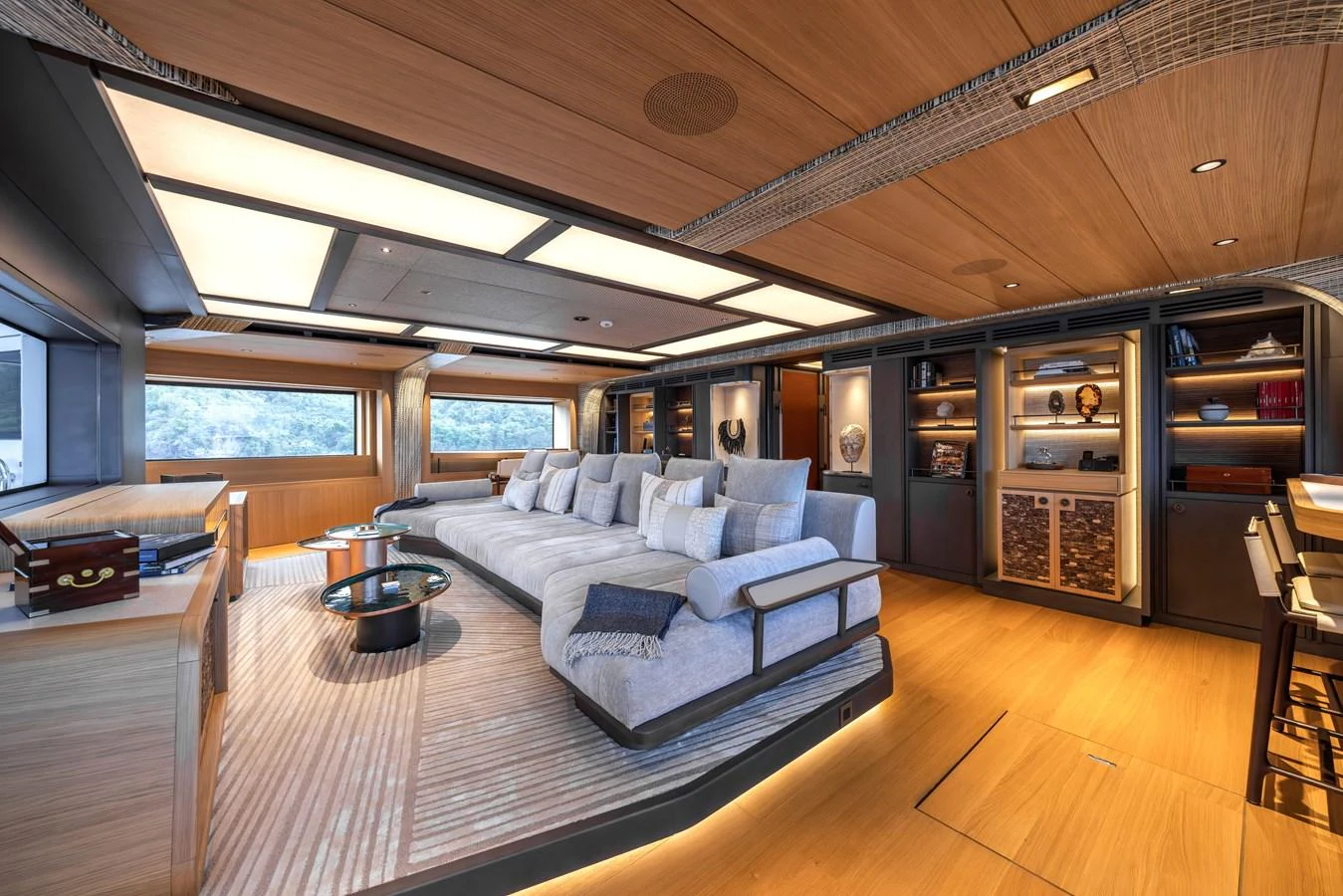 The spacious salon features luxurious seating and elegant decor, perfect for relaxation and entertainment. aboard AKULA Yacht for Sale