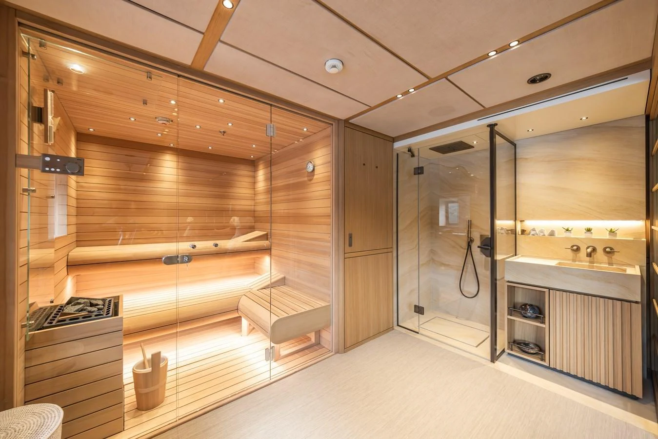 The yacht features a luxurious sauna with adjacent shower facilities, offering a serene and rejuvenating experience. aboard AKULA Yacht for Sale