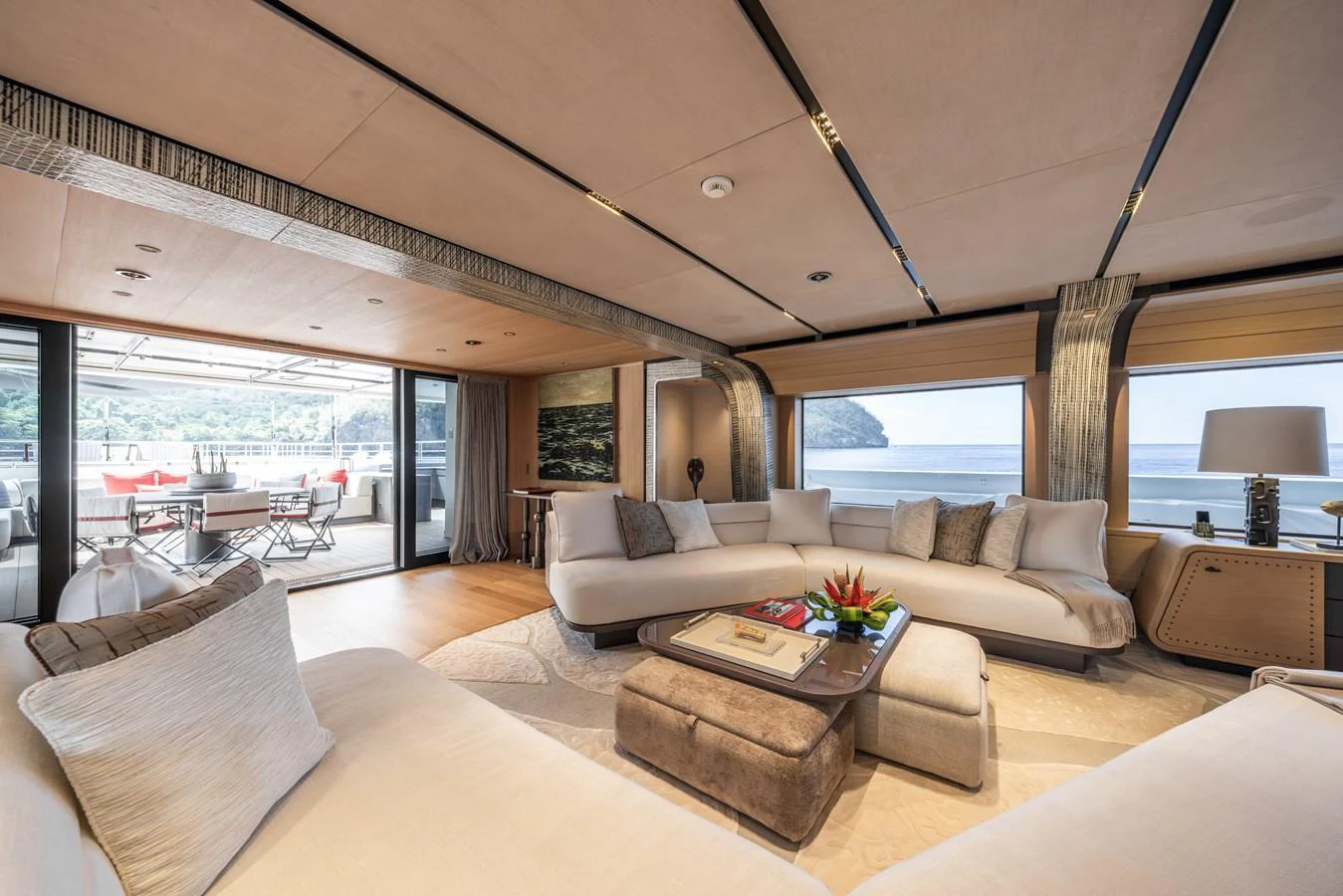 The salon offers a spacious and elegant seating area with panoramic views and access to the aft deck. aboard AKULA Yacht for Sale