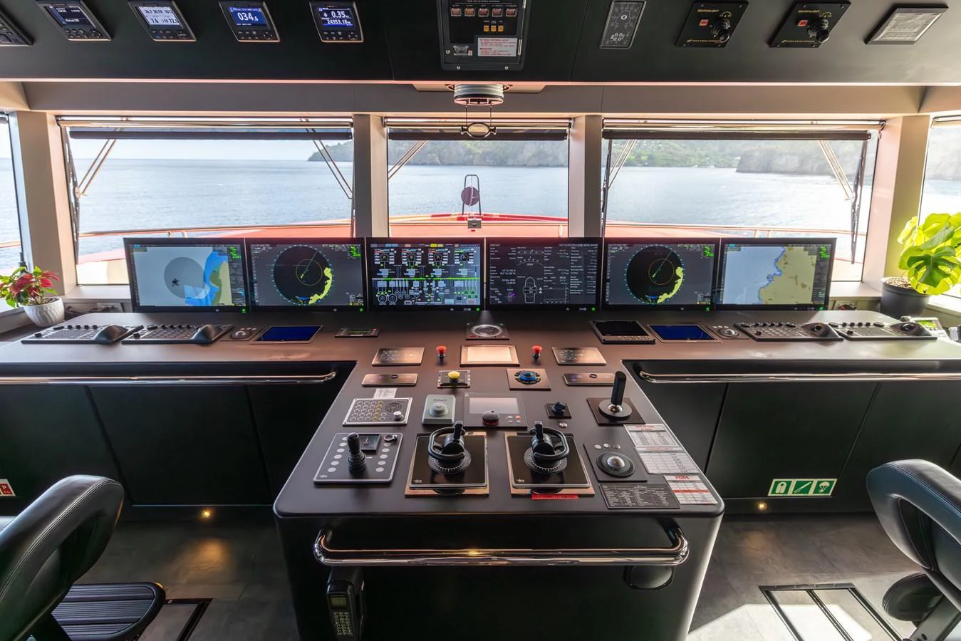 The helm station features advanced navigation equipment and panoramic views for optimal control. aboard AKULA Yacht for Sale