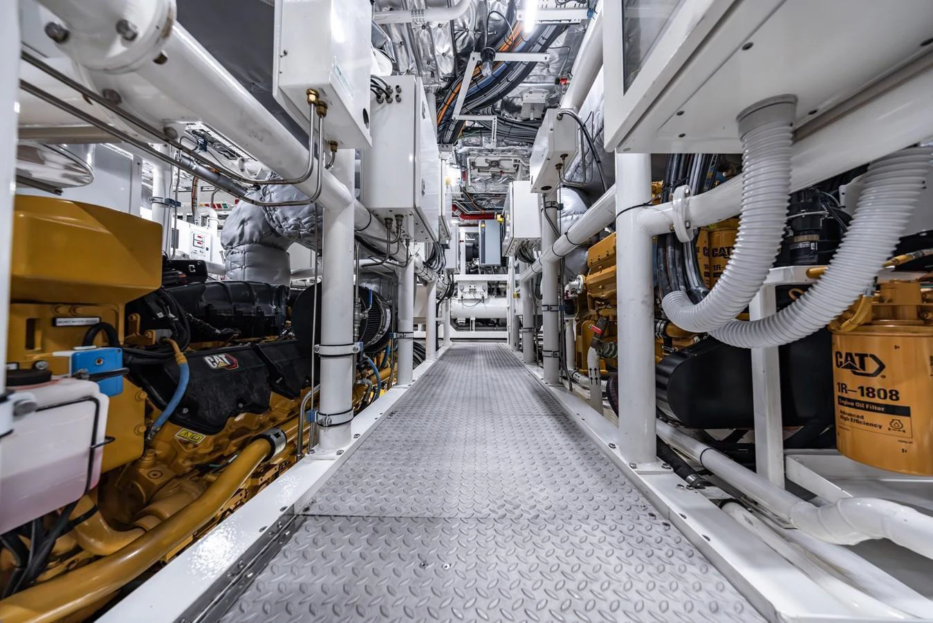 The image showcases the meticulously organized engine room with high-end machinery and equipment. aboard AKULA Yacht for Sale