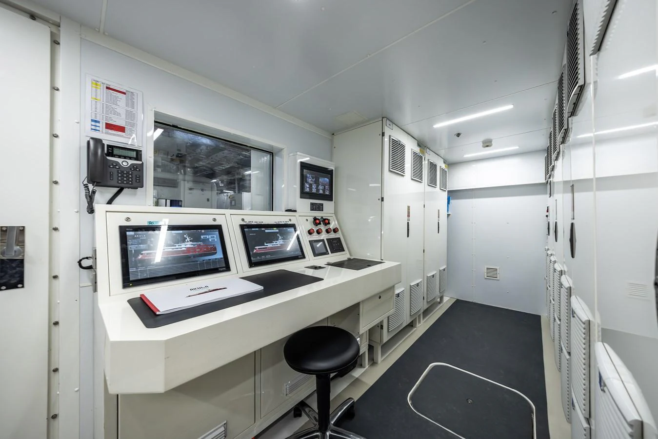 The yacht's control room is equipped with advanced monitoring systems and communication tools. aboard AKULA Yacht for Sale