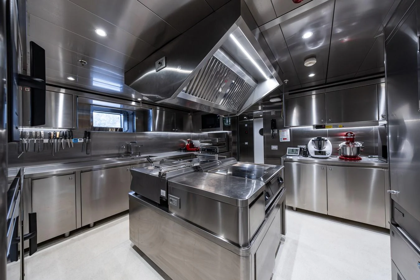 The yacht's galley is equipped with professional-grade stainless steel appliances and ample workspace. aboard AKULA Yacht for Sale