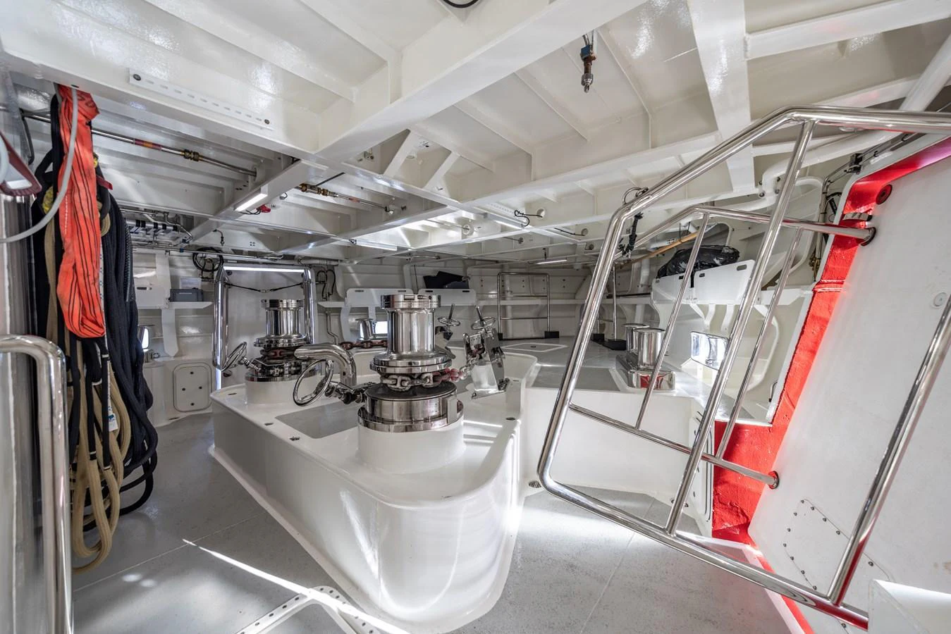 A detailed view of the yacht's engine room showcasing its mechanical components and equipment. aboard AKULA Yacht for Sale