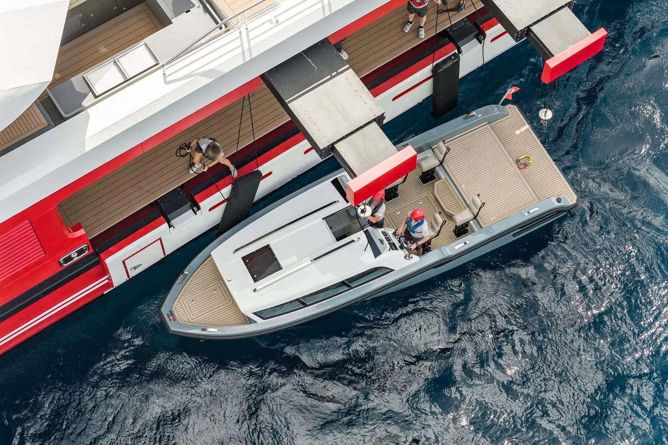 A sleek tender is docked alongside the yacht, showcasing its modern design and functionality. aboard AKULA Yacht for Sale