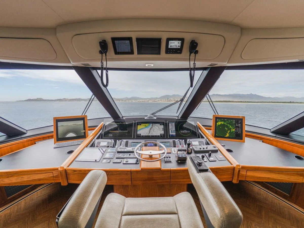 The helm station offers a panoramic view with state-of-the-art navigation equipment. aboard MARLIN MAGIC Yacht for Sale