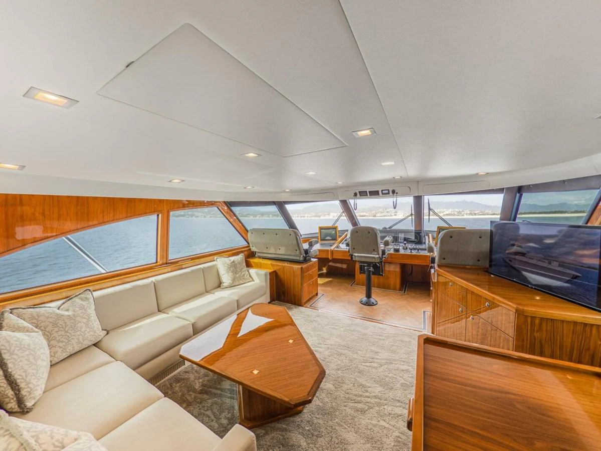 The salon offers a spacious and elegant area with ample seating and panoramic views. aboard MARLIN MAGIC Yacht for Sale