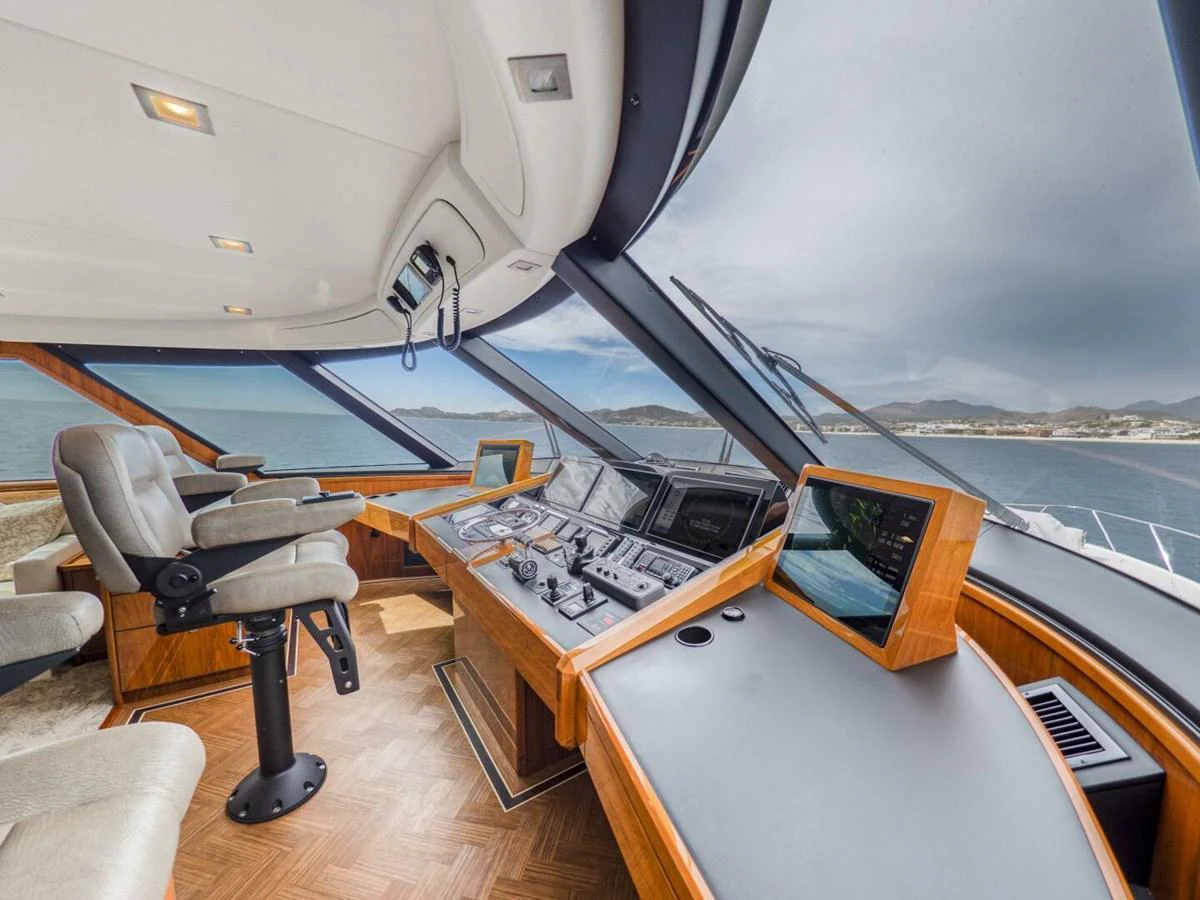 The helm station features state-of-the-art navigation equipment and panoramic views. aboard MARLIN MAGIC Yacht for Sale