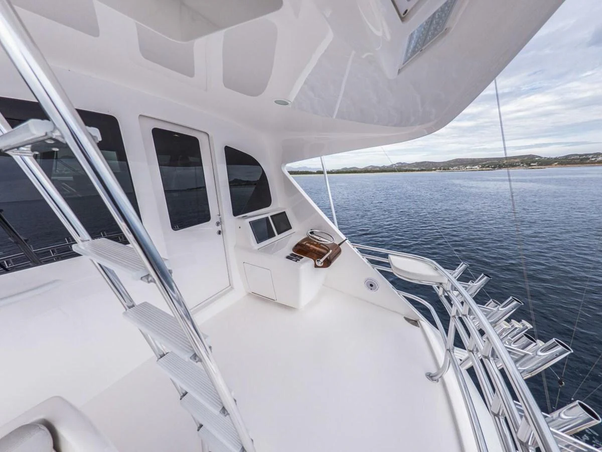 The flybridge offers a pristine and spacious area with a stunning view of the surrounding waters. aboard MARLIN MAGIC Yacht for Sale