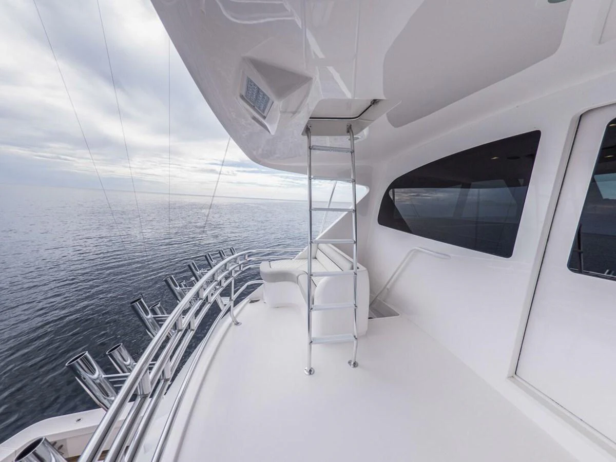 The flybridge offers a spacious and sleek area with a stunning view of the open sea. aboard MARLIN MAGIC Yacht for Sale