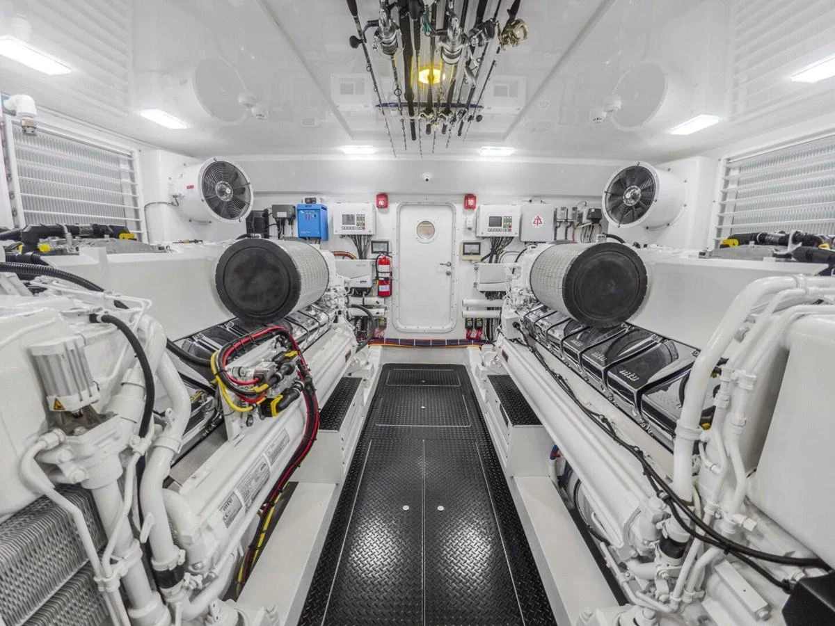 The image showcases a pristine and well-organized engine room with advanced machinery and equipment. aboard MARLIN MAGIC Yacht for Sale