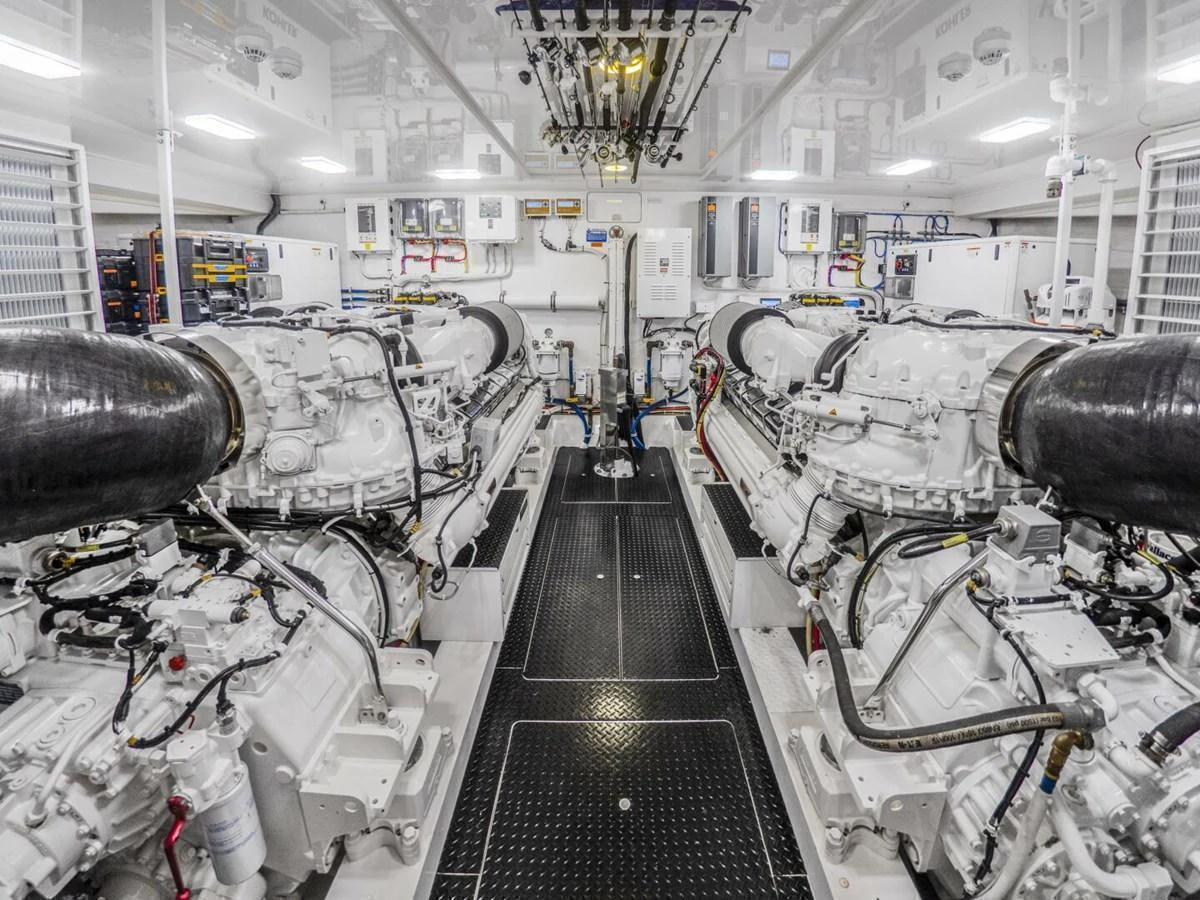 The image showcases a pristine and well-organized engine room with advanced machinery. aboard MARLIN MAGIC Yacht for Sale