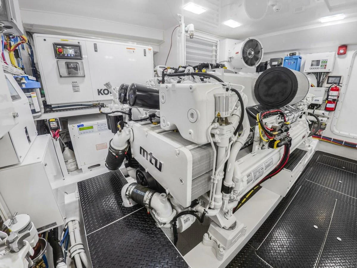 The image showcases a pristine engine room with advanced machinery and equipment. aboard MARLIN MAGIC Yacht for Sale