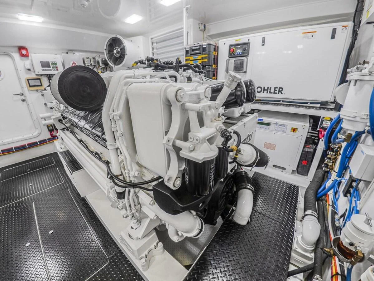 The image showcases the meticulously maintained engine room with advanced machinery and equipment. aboard MARLIN MAGIC Yacht for Sale