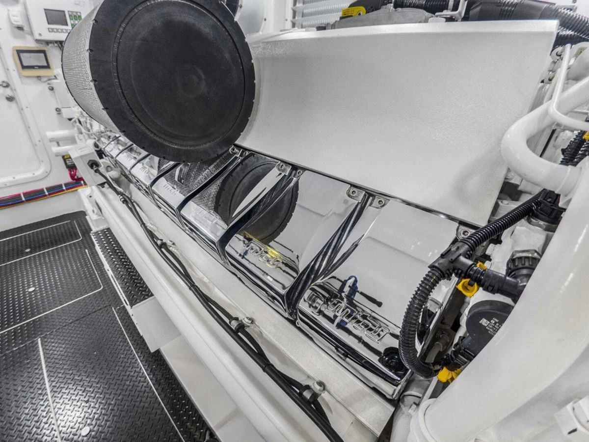 A close-up view of the yacht's engine room showcasing the mechanical components. aboard MARLIN MAGIC Yacht for Sale