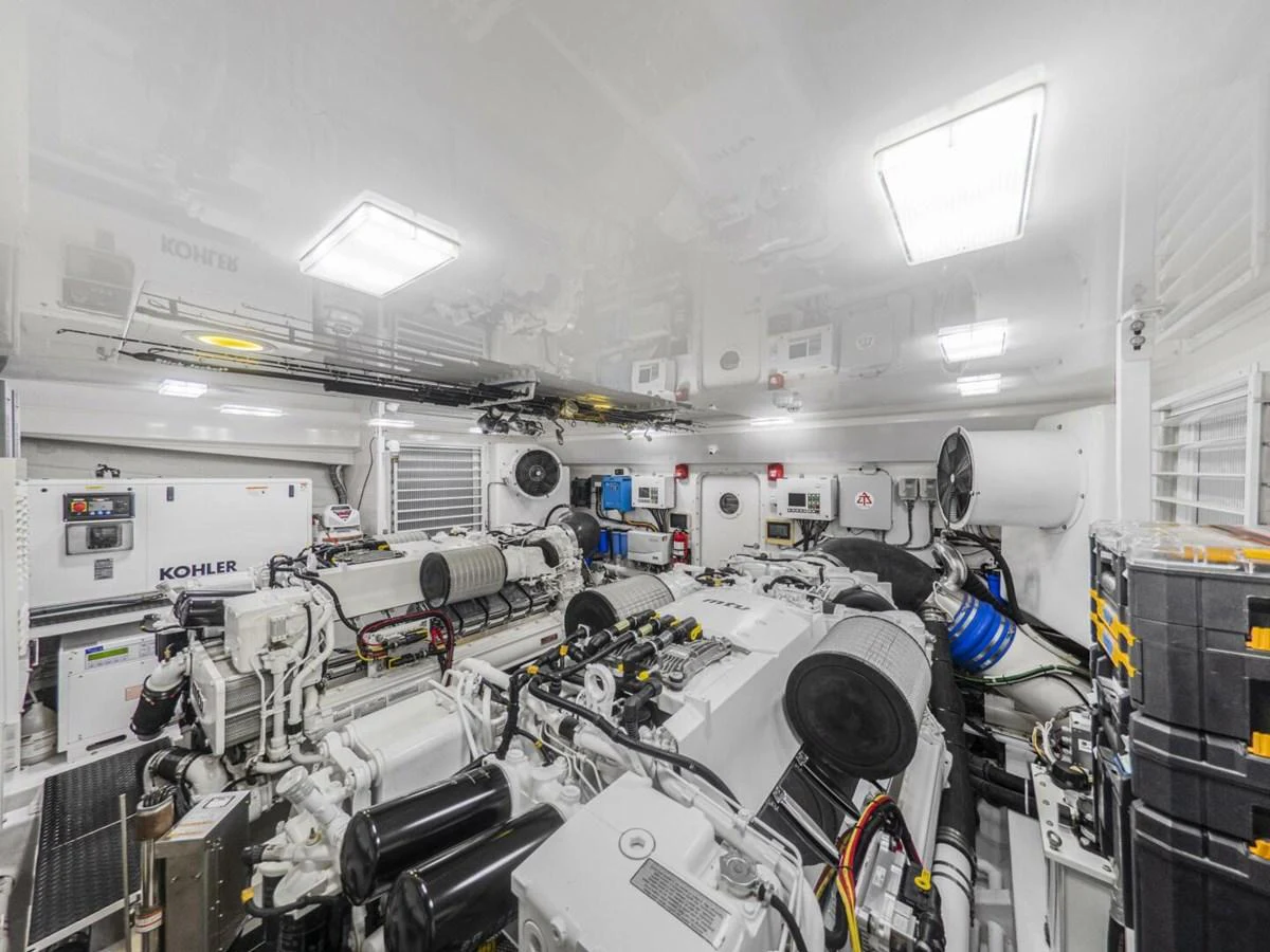 The image showcases a well-organized and clean engine room with advanced machinery and equipment. aboard MARLIN MAGIC Yacht for Sale
