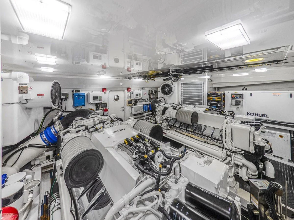 The engine room showcases the yacht's powerful and well-maintained machinery. aboard MARLIN MAGIC Yacht for Sale