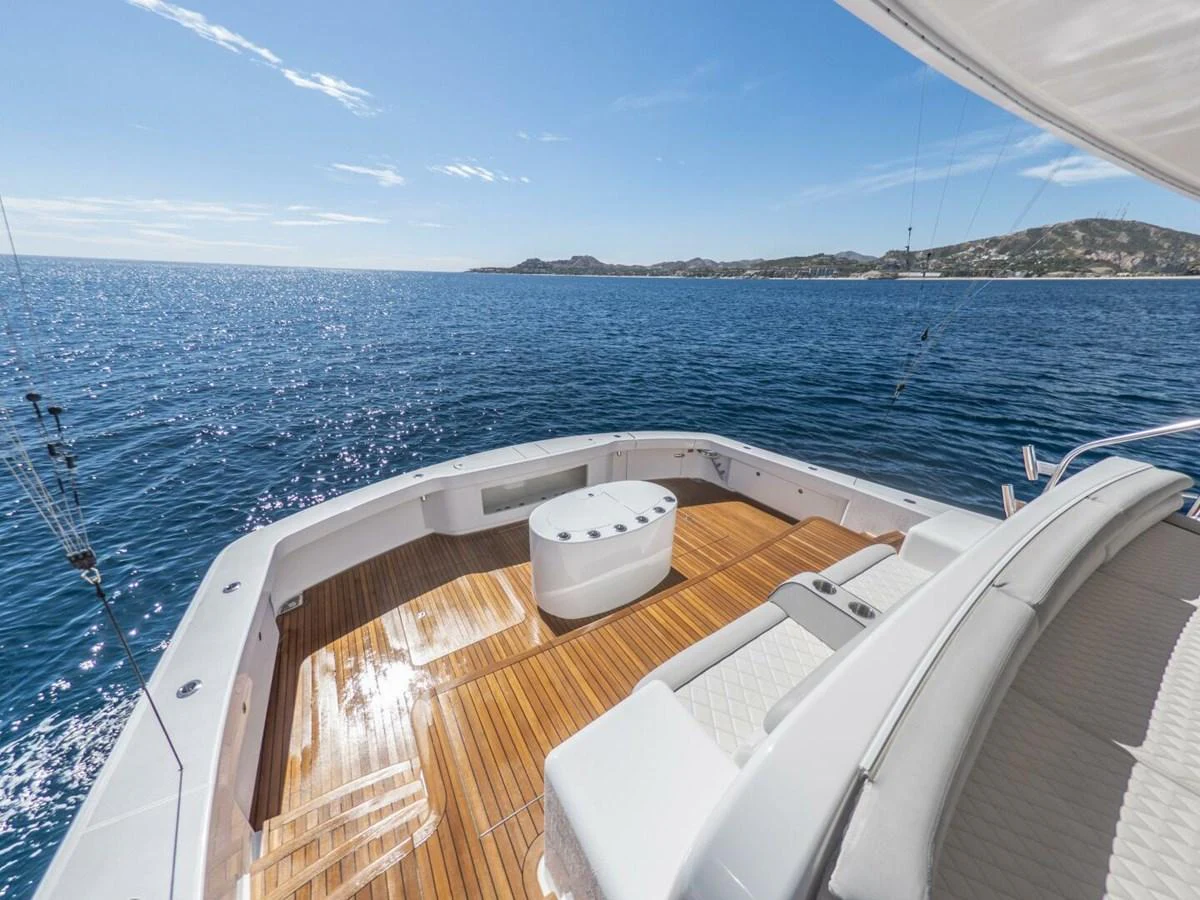 The yacht's aft deck offers a spacious and inviting area with comfortable seating and stunning ocean views. aboard MARLIN MAGIC Yacht for Sale