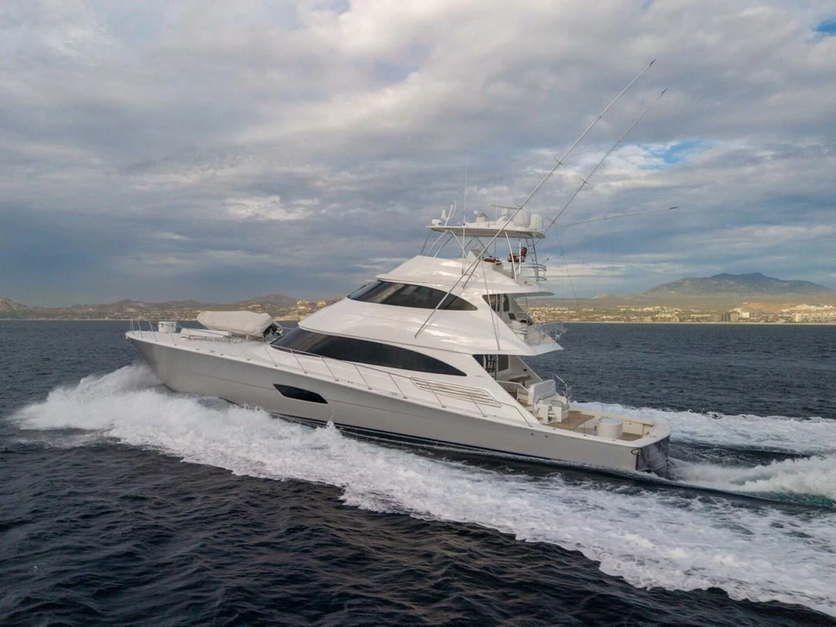 A sleek yacht cruises swiftly through the open water, showcasing its elegant design and powerful performance. aboard MARLIN MAGIC Yacht for Sale