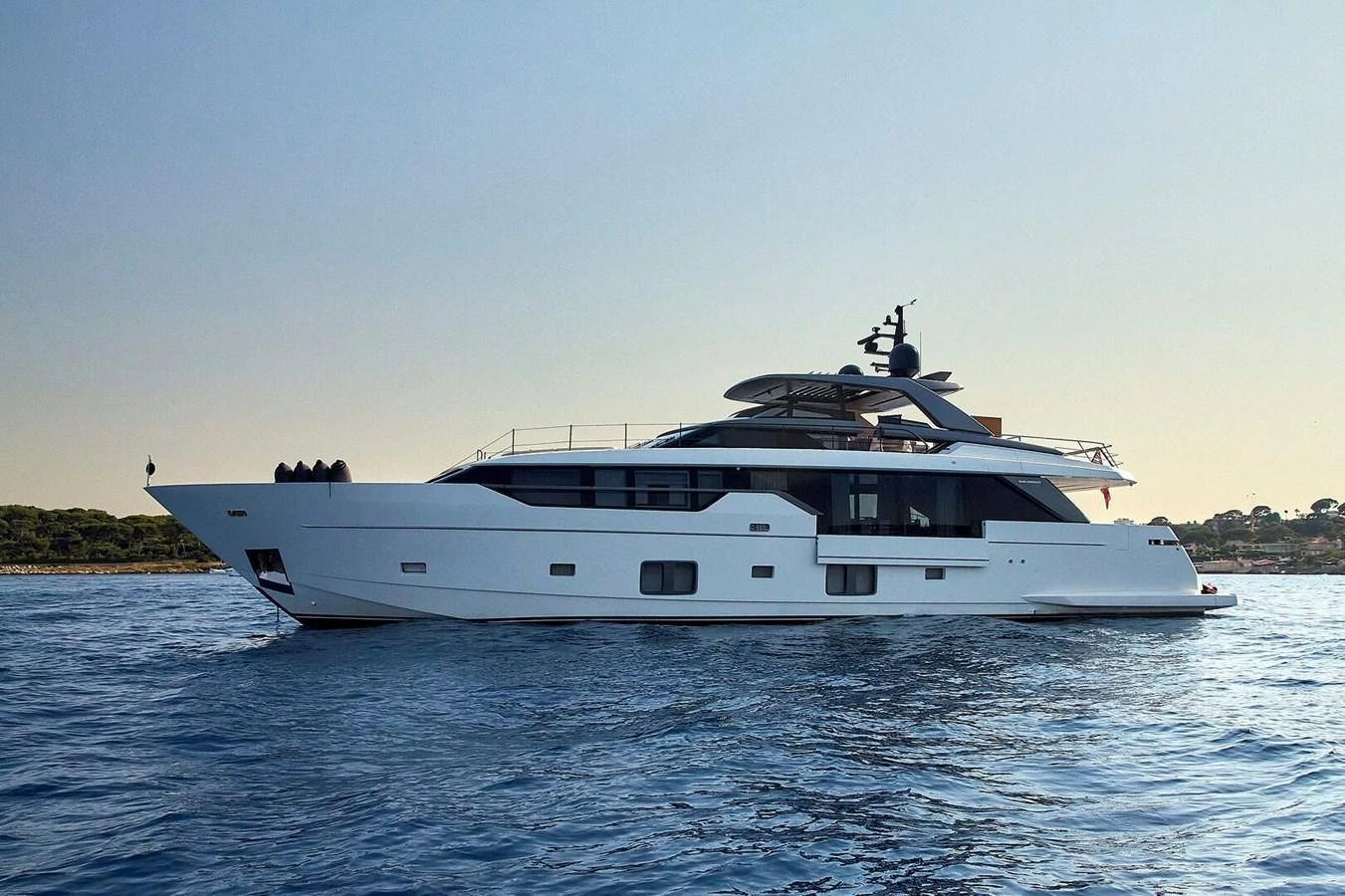 A sleek and modern yacht cruising on calm waters under a clear sky. aboard SANLORENZO SL102 ASYMMETRIC Yacht for Sale
