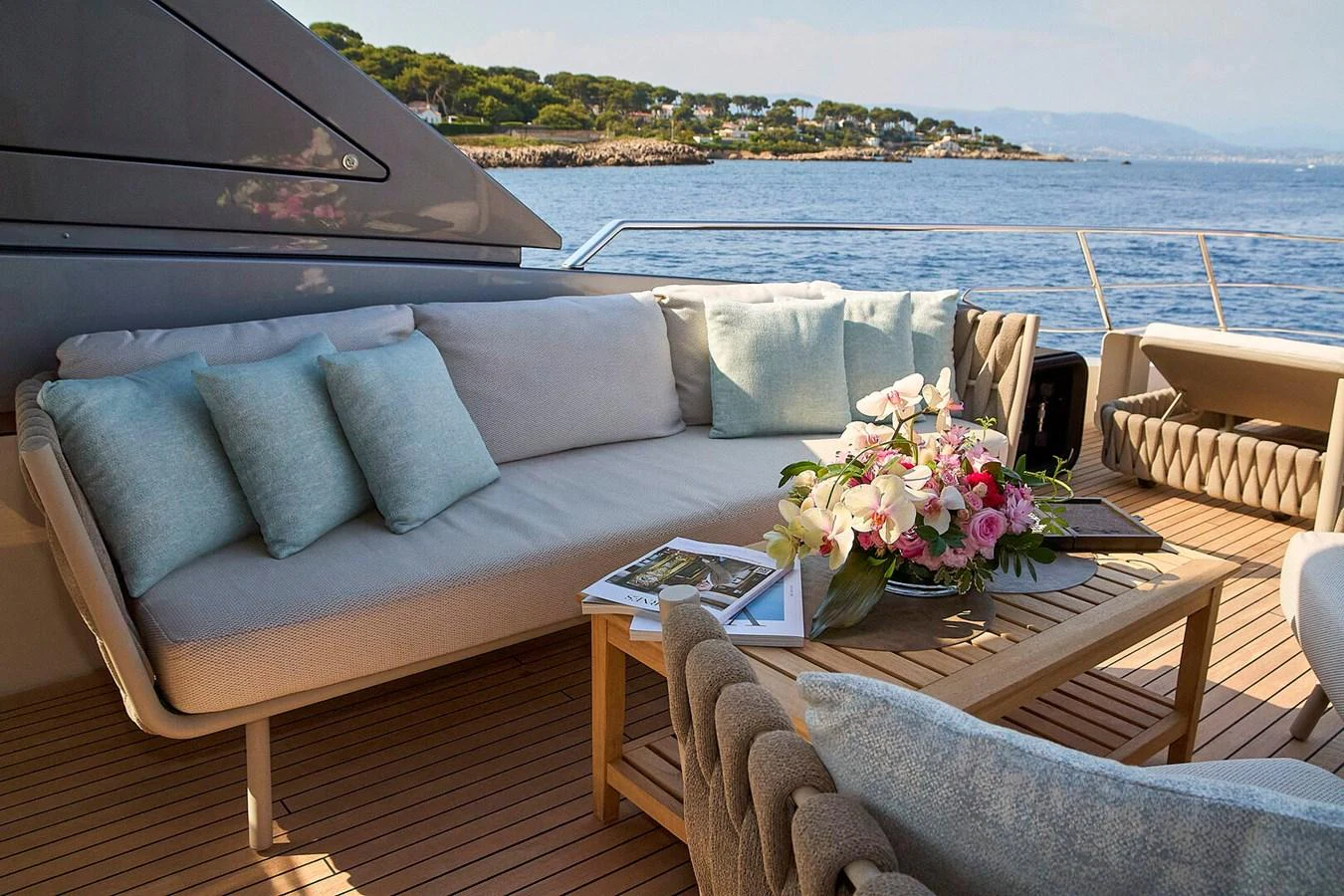 The aft deck features a comfortable seating area with plush cushions and a beautiful view of the water. aboard SANLORENZO SL102 ASYMMETRIC Yacht for Sale