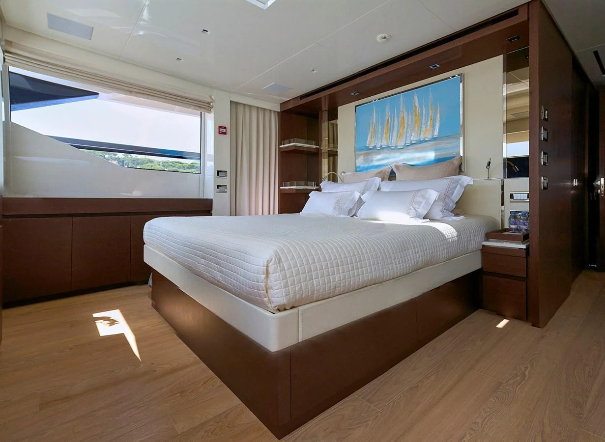 The master stateroom features a luxurious bed with elegant bedding and ample natural light. aboard SANLORENZO SL102 ASYMMETRIC Yacht for Sale