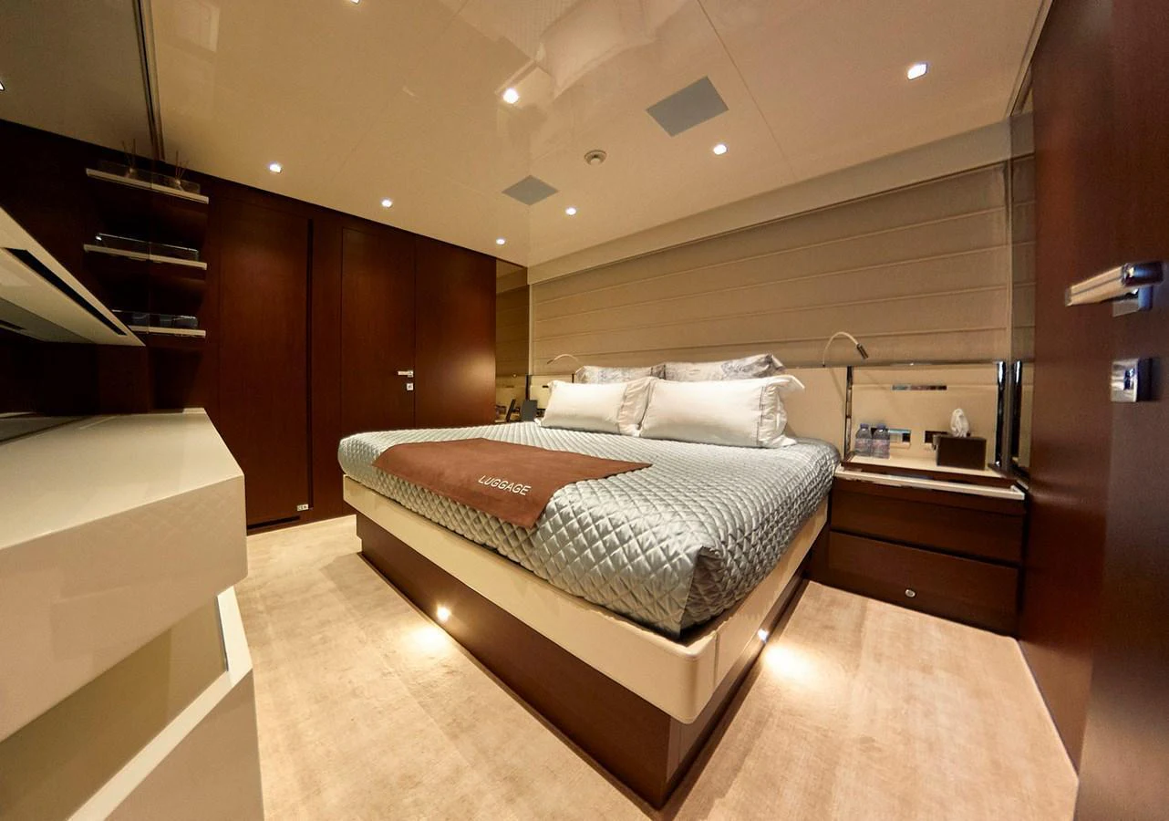 The master stateroom features a luxurious bed with elegant bedding and ample storage space. aboard SANLORENZO SL102 ASYMMETRIC Yacht for Sale