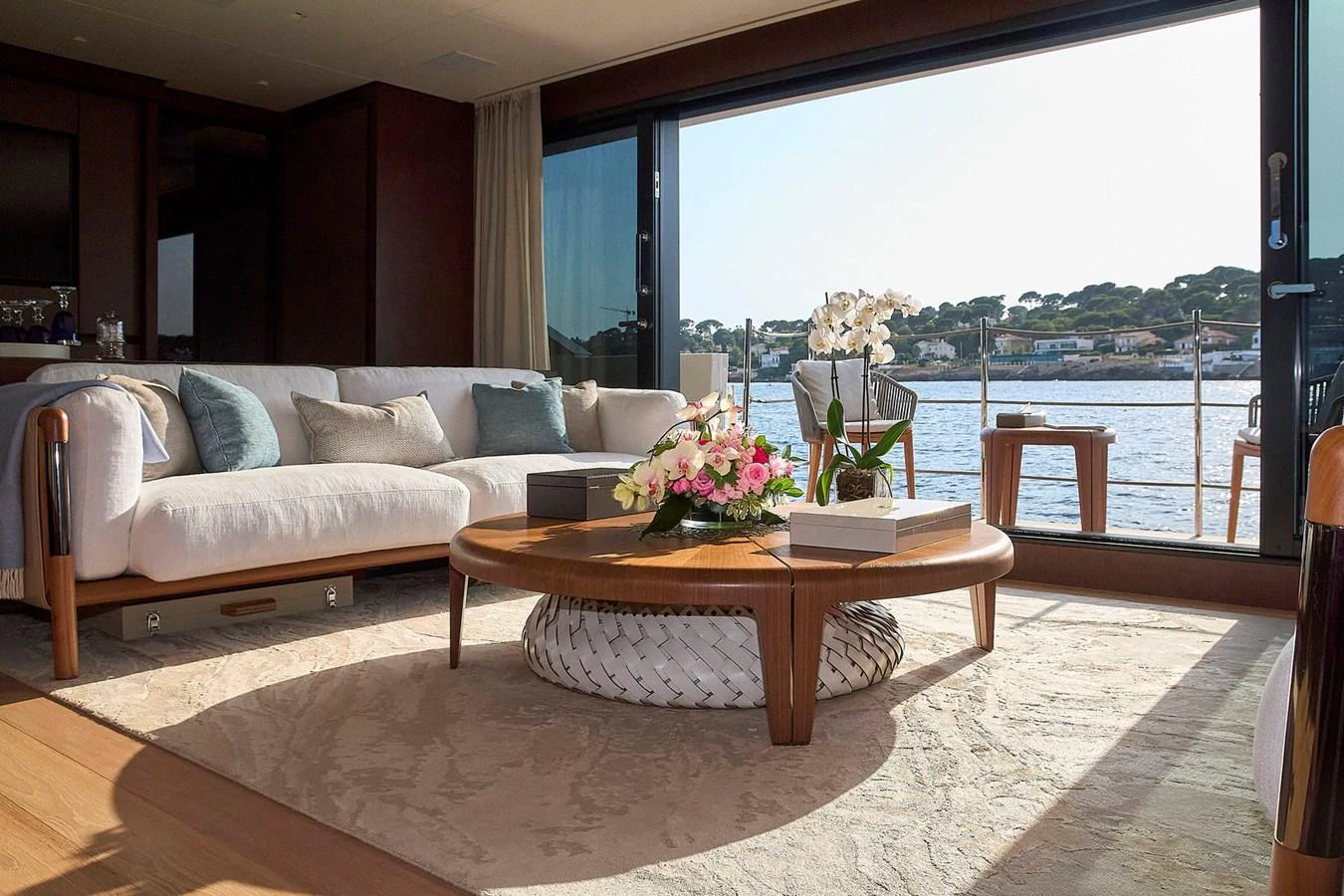The salon offers a luxurious and comfortable space with a stunning view of the water through large windows. aboard SANLORENZO SL102 ASYMMETRIC Yacht for Sale