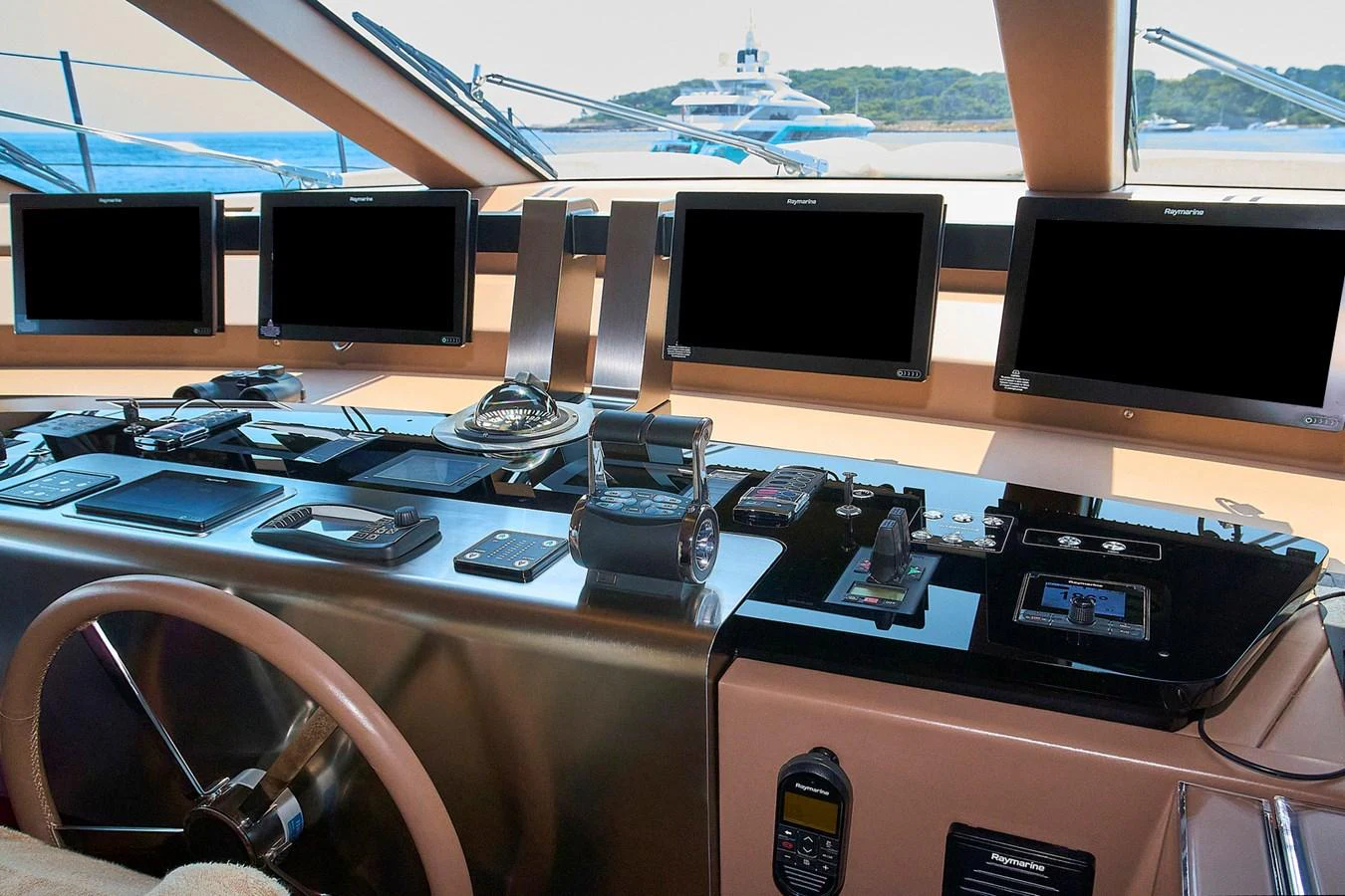 The helm station features advanced navigation equipment and a sleek design, offering a commanding view for the captain. aboard SANLORENZO SL102 ASYMMETRIC Yacht for Sale