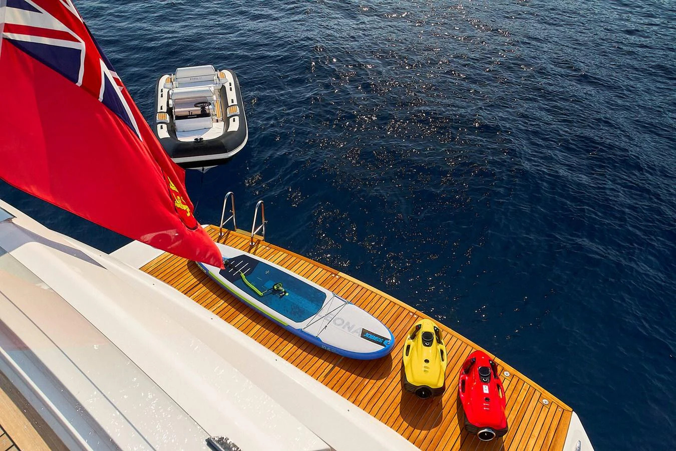 The swim platform is equipped with various water toys and a tender, ready for aquatic adventures. aboard SANLORENZO SL102 ASYMMETRIC Yacht for Sale