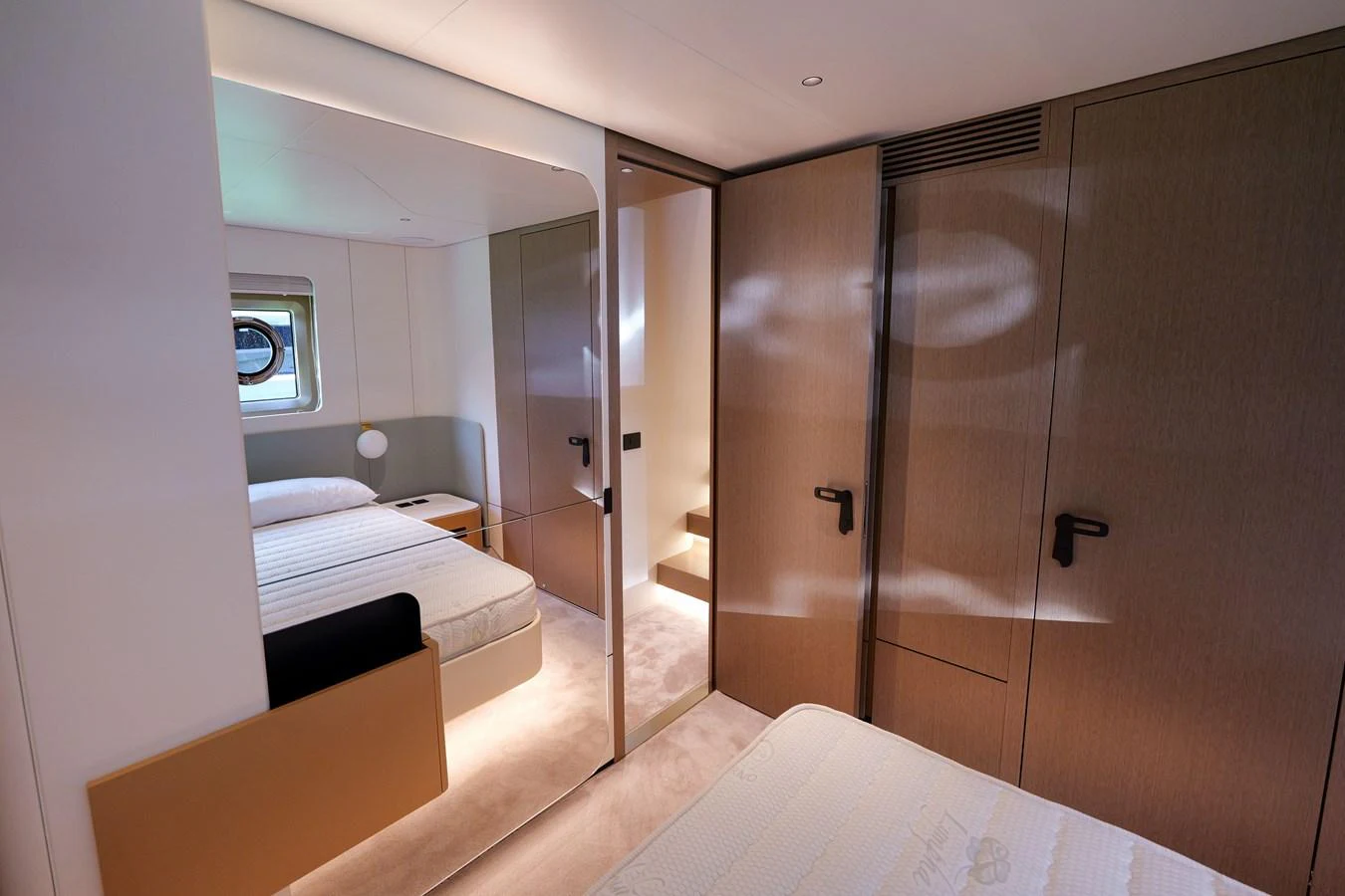 The guest cabin offers a cozy and modern sleeping area with ample storage and natural light. aboard SEA STAR Yacht for Sale