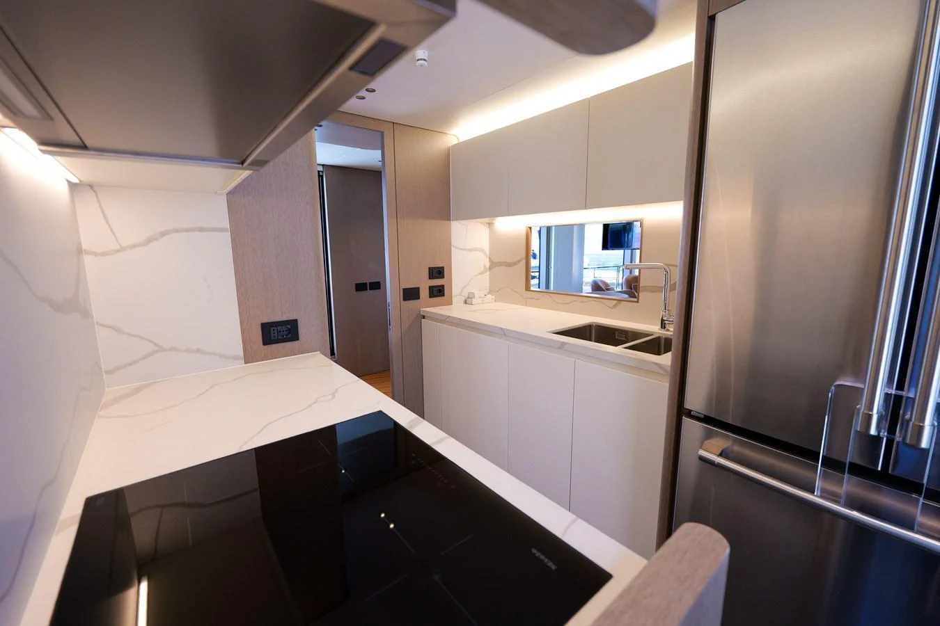 The modern galley features sleek appliances and ample counter space for culinary endeavors. aboard SEA STAR Yacht for Sale