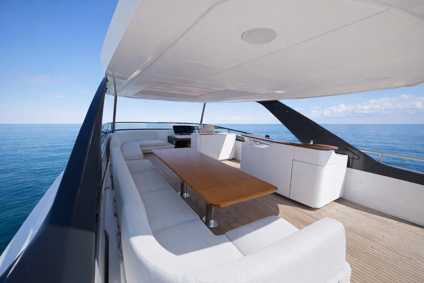 The flybridge offers a spacious and luxurious seating area with panoramic ocean views. aboard SEA STAR Yacht for Sale