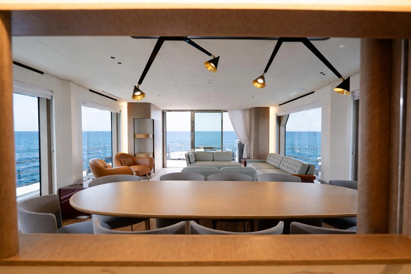 The spacious salon offers panoramic ocean views with modern furnishings and ample seating. aboard SEA STAR Yacht for Sale