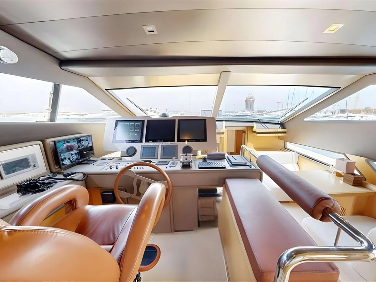 The helm station features advanced navigation equipment and luxurious seating, offering a commanding view for the captain. aboard M/Y ILAV Yacht for Sale