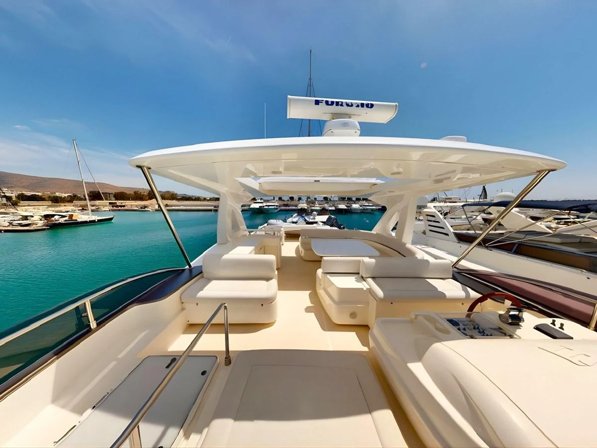 The spacious flybridge offers ample seating and stunning views of the marina. aboard M/Y ILAV Yacht for Sale