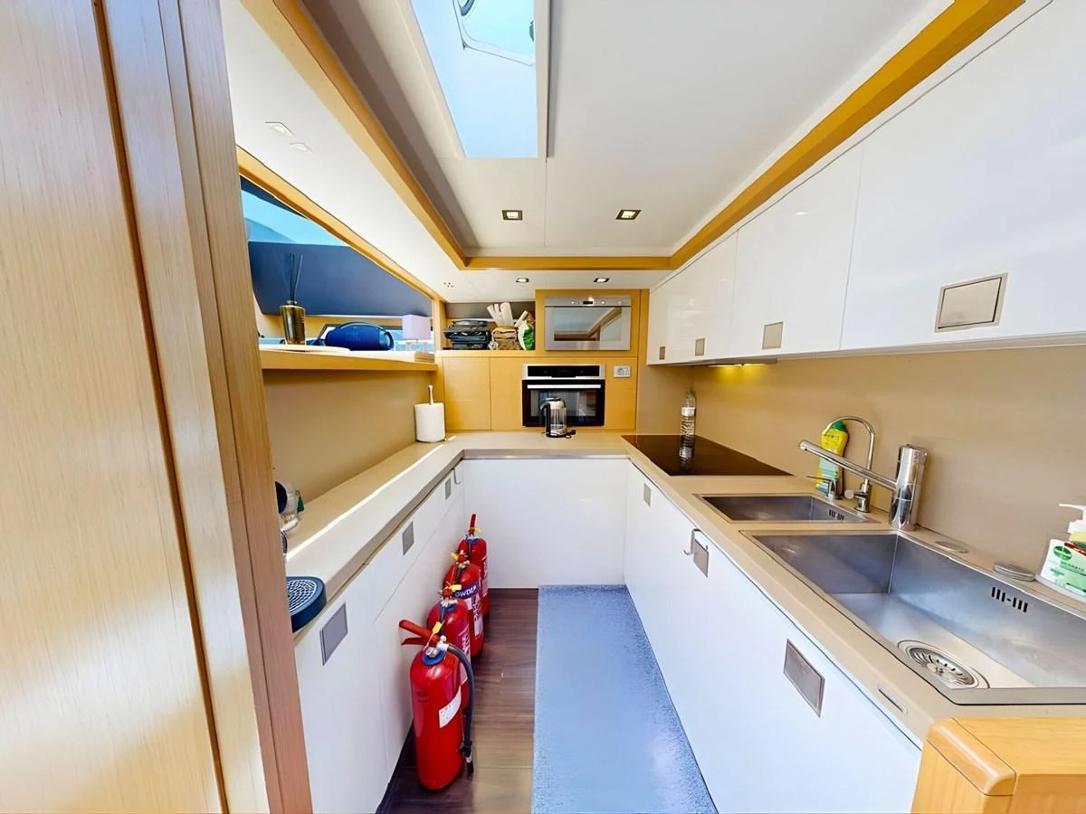 The yacht's galley is well-equipped with modern appliances and ample counter space, providing a functional and stylish area for meal preparation. aboard M/Y ILAV Yacht for Sale