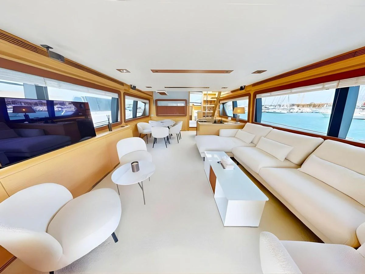 The yacht's salon features plush seating and expansive windows, offering a luxurious and bright living space. aboard M/Y ILAV Yacht for Sale
