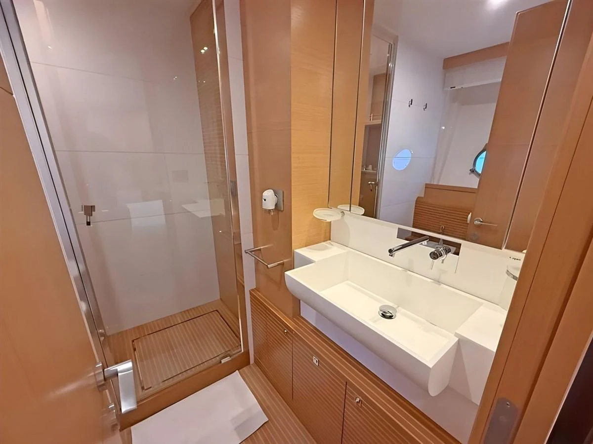 The yacht's bathroom features a sleek, modern design with a spacious shower and elegant fixtures. aboard M/Y ILAV Yacht for Sale