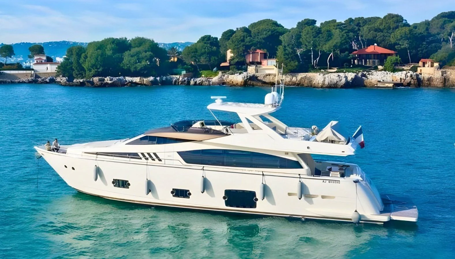 A sleek and modern yacht cruises gracefully on calm waters with a scenic coastal backdrop. aboard M/Y ILAV Yacht for Sale